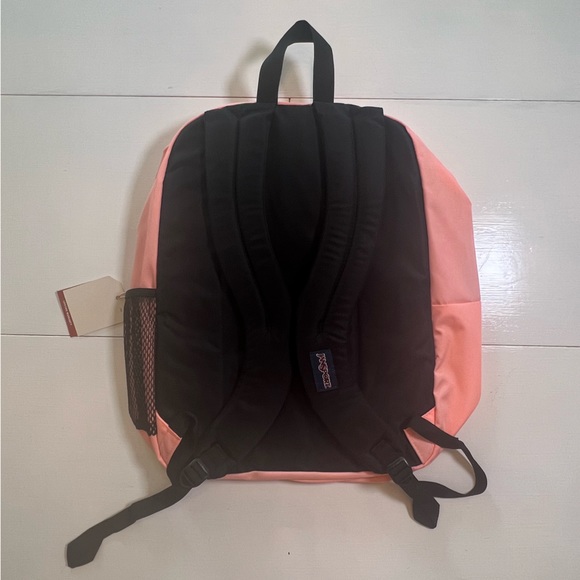 jansport backpack peaches SUPERBREAK with a capacity of 1587 cu in / 26 L and dimensions of 16.5 x 12.5 x 5.5 / 42 x 32 x 13 cm JanSport Big Student Large Backpack